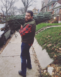Picture of Armin Krauss carrying a christmas tree